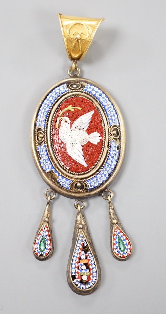 A Victorian yellow metal and micro mosaic set drop mourning pendant, depicting a dove with olive branch, with glazed back, overall 7cm, gross weight 10 grams (a.f.).